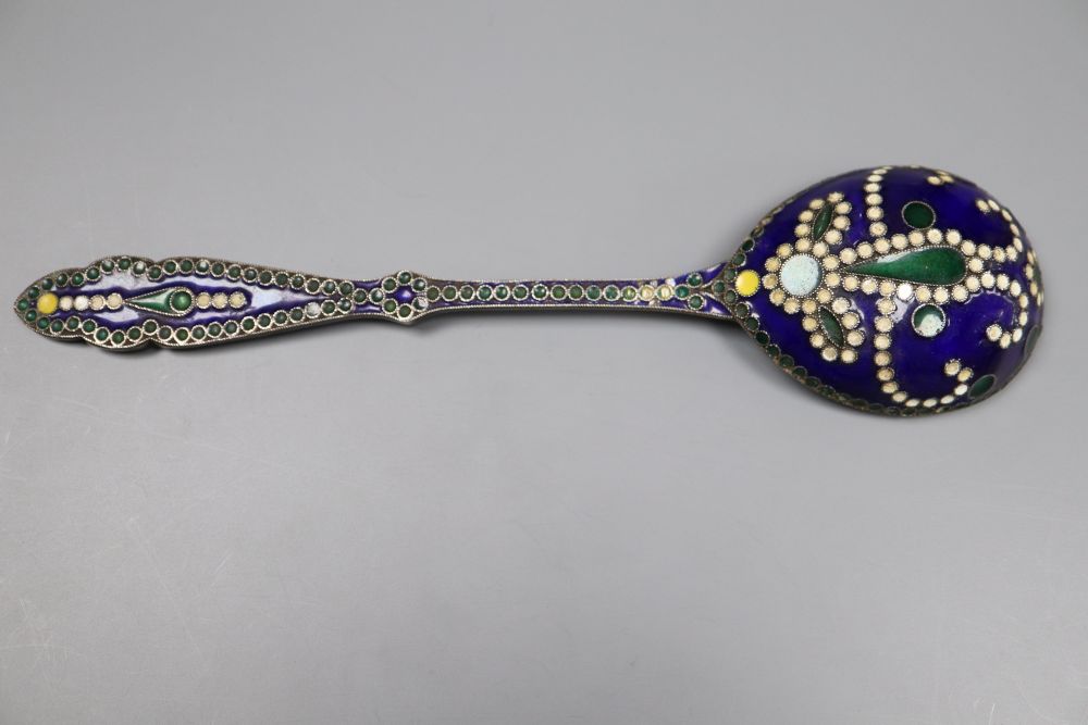 An early 20th century Russian 84 zolotnik and cloisonne enamel spoon, 13.2cm, a white metal and enamel spoon and a plated shovel